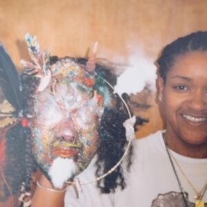 Colorful Beaded Mask with Feathers